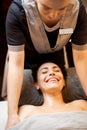Woman receiving relaxation neck massage