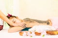 Woman is receiving Spa Charcoal Scrub in Spa Royalty Free Stock Photo