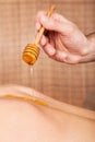 Woman receiving treatment with honey Royalty Free Stock Photo