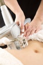 Woman receiving vacuum treatment at body clinic Royalty Free Stock Photo
