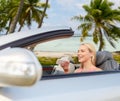 Woman recording voice on smartphone at car Royalty Free Stock Photo