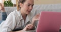 Woman rectifying her mistake using laptop at home