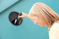 Woman At Recycling Centre At Bottle Bank Royalty Free Stock Photo