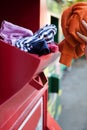 Woman Recycling Clothes At Clothing Bank