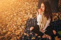 Woman with red apple in autumn park. Royalty Free Stock Photo