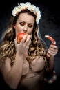 Woman with red apple and snake Royalty Free Stock Photo