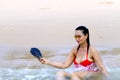 Woman with red bikini shape beautiful relax on beach