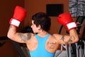 Woman in red boxing gloves