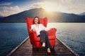 Woman on the red chair on moorage