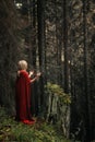 Woman with red cloak praying Royalty Free Stock Photo