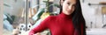 Woman in red clothes is standing in the kitchen Royalty Free Stock Photo