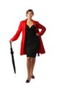 A woman in a red coat and holding an umbrella Royalty Free Stock Photo