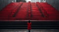 a woman in a red coat stands in front of some red stairs