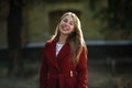 Young woman walking wearing red coat Royalty Free Stock Photo