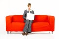 Woman on red couch Royalty Free Stock Photo