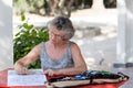 Woman at red desk