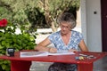 Woman at red desk