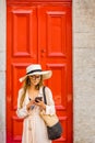 Woman on the red door background Royalty Free Stock Photo