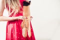 Woman in red dott dress holding tan vintage stockings Royalty Free Stock Photo