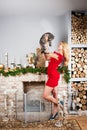 Woman in red dress with cat on Christmas location Royalty Free Stock Photo