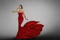 Woman Red Dress, Fashion Model in Long Waving Silk Gown Royalty Free Stock Photo