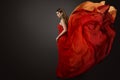 Woman Red Dress Flying on Wind, Beautiful Fashion Model in Fluttering Gown Royalty Free Stock Photo