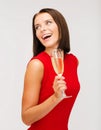 Woman in red dress with a glass of champagne Royalty Free Stock Photo