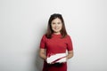 Woman in a red dress holding gift box on white Royalty Free Stock Photo