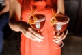 Woman in red dress holding three glasses with fresh cocktails Royalty Free Stock Photo