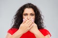 Woman in red dress over grey background Royalty Free Stock Photo