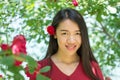 Woman in red dress with red rose in her hair Royalty Free Stock Photo