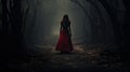 A Woman in red dress walking on a dark path in a strange dark forest with fog