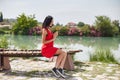 Woman in a red dress walks through Pamukkale, Turkey. Beautiful view of the sights Royalty Free Stock Photo