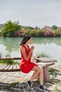 Woman in a red dress walks through Pamukkale, Turkey. Beautiful view of the sights Royalty Free Stock Photo