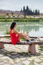 Woman in a red dress walks through Pamukkale, Turkey. Beautiful view of the sights Royalty Free Stock Photo