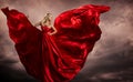 Woman Red Dress Wings, Fashion Model Silk Waving Gown, Flying Fluttering Fabric on Storm Wind Royalty Free Stock Photo