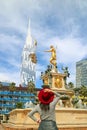 Woman in Red Hat Impressed by the Gorgeous Neptune Fountain on Theater Square in Batumi, Georgia