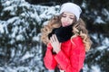 Woman in a red jumpsuit in the winter Royalty Free Stock Photo