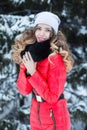 Woman in a red jumpsuit in the winter Royalty Free Stock Photo