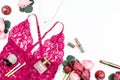 Woman red lace lingerie, flowers, make up items on white background. Postcard for Womens Day. Royalty Free Stock Photo