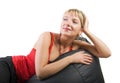 Woman in red laying on sofa Royalty Free Stock Photo