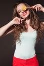 Beautiful woman with red lips eats a big candy sweet lollipop Royalty Free Stock Photo