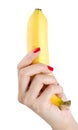 Woman with red nails holding banana.