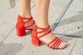 Woman with red open shoes before Tiziano Guardini fashion show, Milan Fashion Week street style