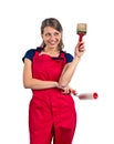 Woman in red overalls with painting tools Royalty Free Stock Photo