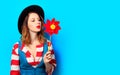 Woman with red pinwheel Royalty Free Stock Photo