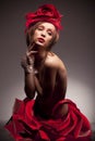 Woman in red rose hat and dress Royalty Free Stock Photo