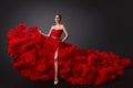 Woman in Red Ruched Dress, Fashion Model in Long Fluffy Waving Gown Royalty Free Stock Photo