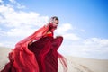 Woman in red. Run away girl in amazing scarlet dress. Royalty Free Stock Photo