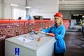 Woman in red safety helmet work as industrial worker Royalty Free Stock Photo